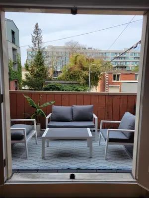 a view of a patio with a couch and two chairs at Cozy 3BR Retreat with Dedicated Work table and Parking in Toronto