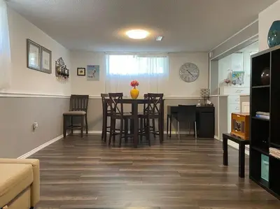 a living room with a dining room table and chairs at 2 bedroom rental apartment , 1 sofa bed, 2 car parking in Mississauga