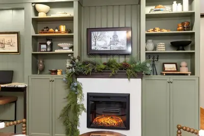 a fireplace in a living room with a christmas mantle at 4Bdrm Muskoka Retreat, Fire Table, Games, Netflix in Port Carling