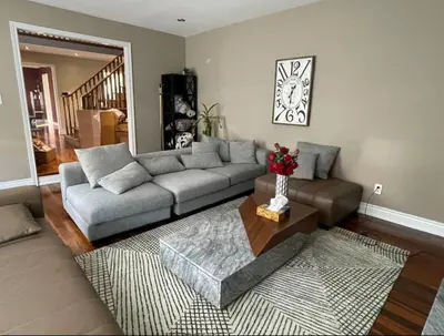 a living room with a couch and a table at Family-Friendly Retreat for 14 in Richmond Hill in Richmond Hill