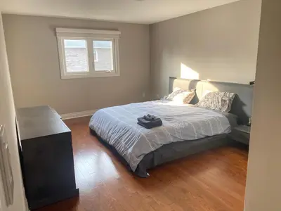 a bedroom with a large bed and a window at Family-Friendly Retreat for 14 in Richmond Hill in Richmond Hill
