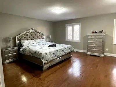 a bedroom with a large bed and a dresser at Family-Friendly Retreat for 14 in Richmond Hill in Richmond Hill