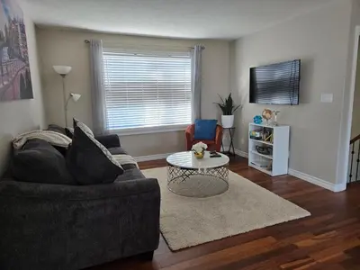 a living room with a couch and a table at Beautiful House 2 bedroom in Belleville
