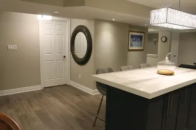 a kitchen with a counter and a mirror on the wall at Fully Furnished Guest Suite in Richmond Hill