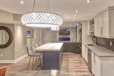a kitchen with a island with a bar in it at Fully Furnished Guest Suite in Richmond Hill