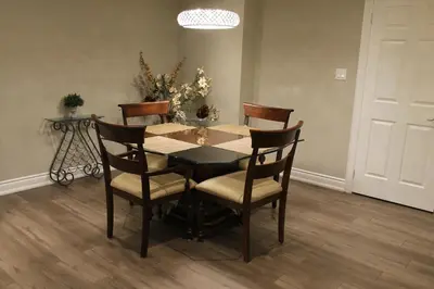 a dining room table and chairs in a room at Fully Furnished Guest Suite in Richmond Hill