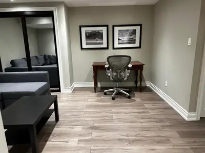 a living room with a desk and a chair at Fully Furnished Guest Suite in Richmond Hill