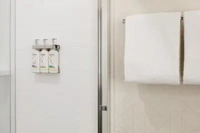 a bathroom with a shower stall with a towel at Holiday Inn Express Hamilton - Upper James by IHG in Hamilton