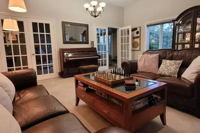 a living room with a couch and a coffee table at Summer Getaway with Pool and Nearby Attractions in Cobourg