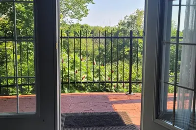 an open door with a view of a fence at Summer Getaway with Pool and Nearby Attractions in Cobourg