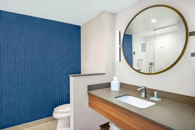 a bathroom with a sink and a mirror at Fairfield by Marriott Inn & Suites Gravenhurst Muskoka in Gravenhurst