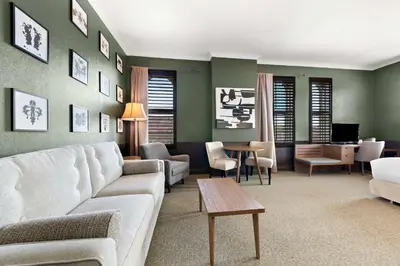a living room with a couch and a table at The Arlington Hotel - BW Signature Collection in Paris