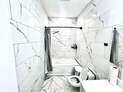 a white bathroom with a toilet and a sink at Private Room In Cambridge B9 in Cambridge