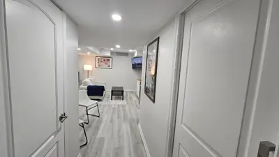 a hallway leading to a room with a living room at Garden Ave Home 1mins to HWY 403 in Brantford