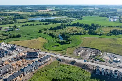 an aerial view of a construction site with green fields at Executive Brand New House 5 Bedrooms and Office in Cambridge