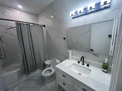 a bathroom with a sink and a toilet and a mirror at Private Bathroom Room In Cambridge B7 in Cambridge