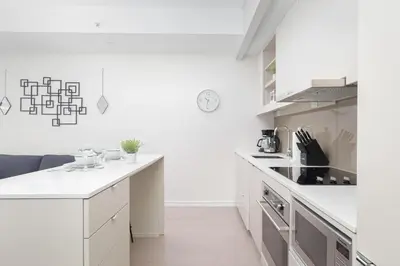 a kitchen with white cabinets and a counter top at 1BR Space - Downtown Toronto in Toronto