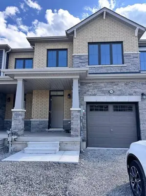 a house with a car parked in front of it at New 3-BR Home Near Niagara Falls with King Bed 75 Inch TV and Free Parking in Thorold