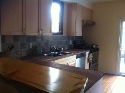 a kitchen with a wooden counter top and a sink at Lovely home in Leslieville in Toronto