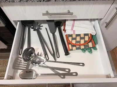 a drawer filled with kitchen utensils in a cabinet at Brand New Luxurious 4B Townhouse in Oshawa