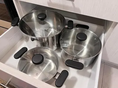 three pots and pans sitting on top of a stove at Brand New Luxurious 4B Townhouse in Oshawa