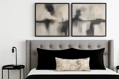 a bedroom with a bed with three pictures on the wall at Upscale 1 Bed & Den Downtown Toronto in Toronto