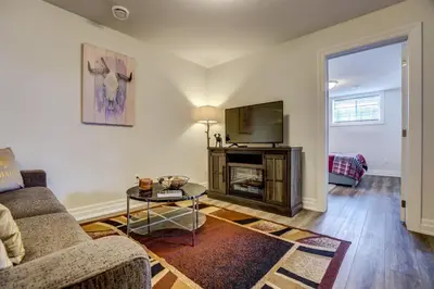 a living room with a couch and a tv at GLOBALSTAY New Basement 4 Bd in Port Elgin in Port Elgin