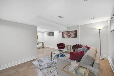 a living room with a couch and a table at Modern 5BR Home with Office and Parking and WiFi in Oakville