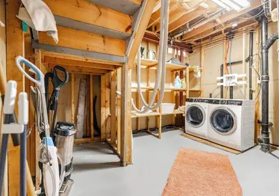 a laundry room with a washing machine in it at 2 bedroom apartment-2 free parking -14 min to Pearson airport in Mississauga