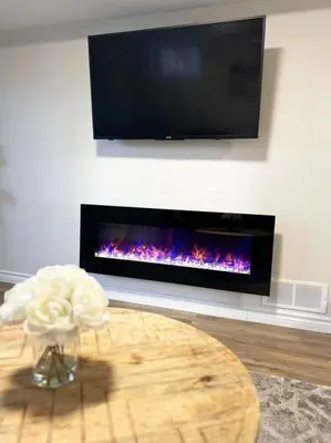 a living room with a table and a fireplace at Modern & Cozy 1 Bedroom with fast Wi-Fi, BBQ & Patio in Barrie