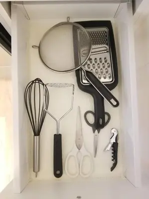a drawer filled with kitchen utensils and a calculator at Modern & Cozy 1 Bedroom with fast Wi-Fi, BBQ & Patio in Barrie