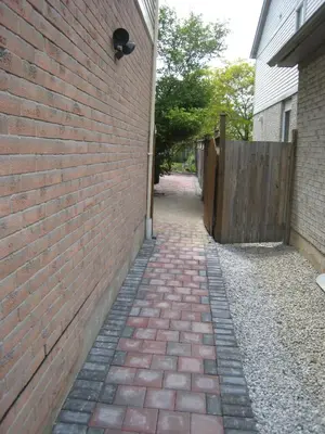 a brick alleyway next to a brick wall at Sunnys Home Stays 1 Bedroom Bath & Kitchenette Toronto Mississauga At Erin Mills With Pvt Entrance in Mississauga