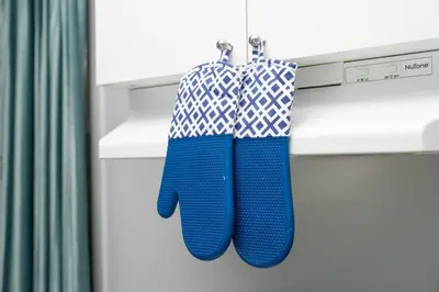 two blue and white towels hanging on a drawer at Private Cozy Room with Free Parking in Toronto