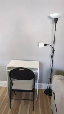 a desk with a chair and a lamp next to a bed at Multiple Fair Price Great Amenities Rooms in Richmond Hill