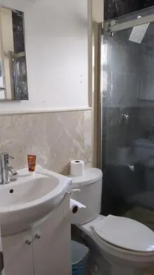 a bathroom with a sink and a toilet and a shower at Multiple Fair Price Great Amenities Rooms in Richmond Hill