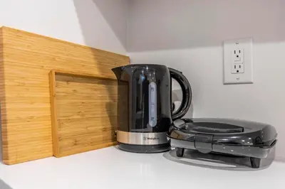 a black coffee maker sitting on top of a counter at Private House with parking & steps to subway in Toronto