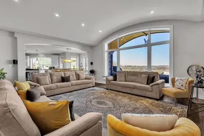 a large living room with couches and a kitchen at Private Farmhouse Getaway with hot tub in Waterloo