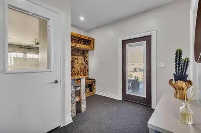 a room with a door and a table and a window at Private Farmhouse Getaway with hot tub in Waterloo