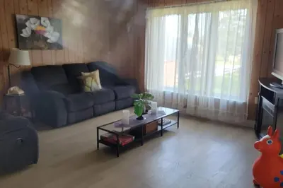 a living room with a couch and a coffee table at ARCA Cozy Cabin-Innisfil Beach in Innisfil