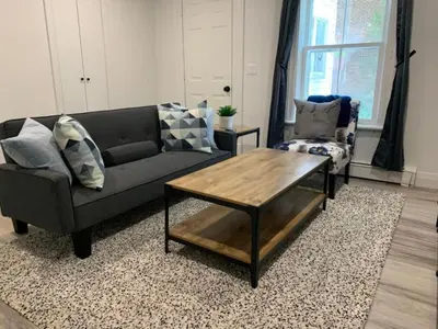 a living room with a couch and a coffee table at County Cove - Wellington Suite - Two-Bedroom Wellington Apartment in Wellington