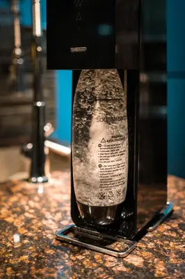 a bottle of wine sitting on top of a counter at 44th Floor, Panoramic Views, Bay Corridor Downtown Toronto Condo in Toronto