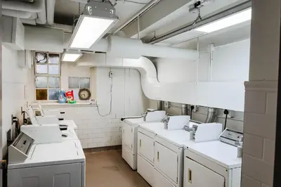 a laboratory with white appliances in a room at Knox Residence - University of Toronto in Toronto