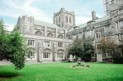 a large stone building with a green yard at Knox Residence - University of Toronto in Toronto