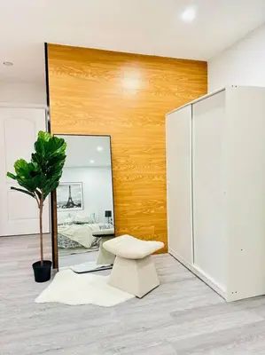 a room with a chair and a mirror at Cozy private backyard garden studio in Pickering