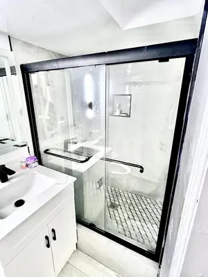 a bathroom with a shower and a white sink at Private Room Near Airport D7 in Brampton