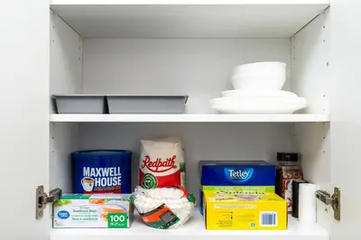 a shelf with food and other items in a refrigerator at Bright & Stylish Modern Townhome in Oakville! in Oakville