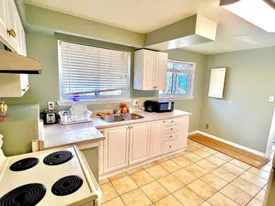 a kitchen with a sink and a stove at D3 Room Near Airport in Brampton