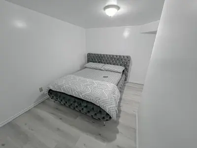 a small bedroom with a bed in a room at Private Room Near Airport D6 in Brampton