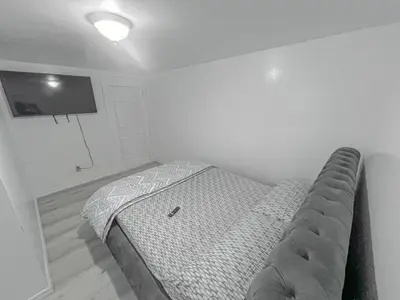 a small bedroom with a bed in the corner at Private Room Near Airport D6 in Brampton