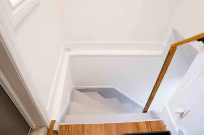 a white stair case with a white ceiling at Adorable 3 Bedroom Apartment with Free Parking in Ajax